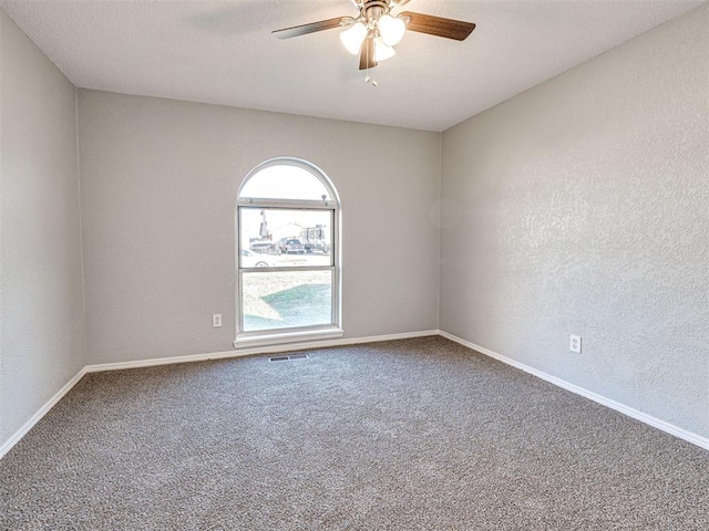 unfurnished room featuring carpet flooring and ceiling fan