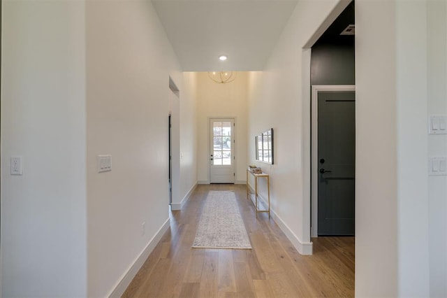 corridor with light wood-type flooring