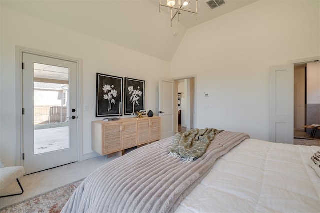 bedroom featuring carpet flooring, a chandelier, access to exterior, and vaulted ceiling