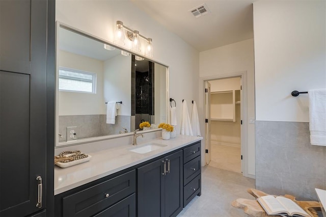 bathroom featuring tile patterned floors and vanity