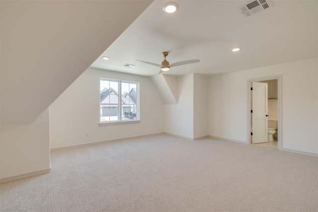 bonus room with light carpet, ceiling fan, and lofted ceiling