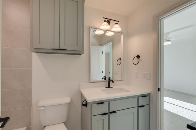 bathroom featuring vanity and toilet