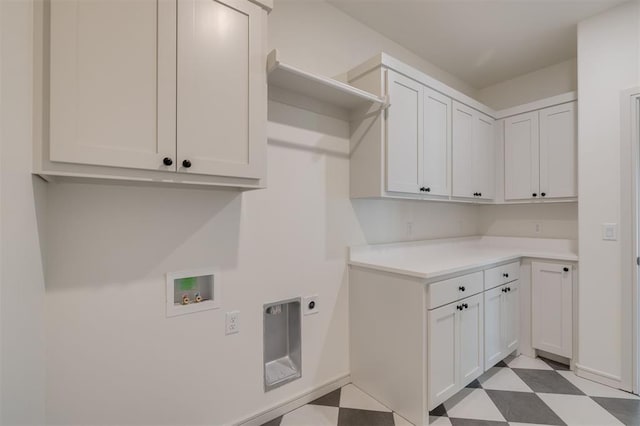 laundry area with hookup for a washing machine, cabinets, and hookup for an electric dryer