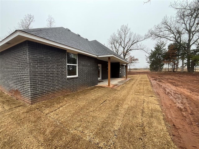 view of home's exterior featuring a patio