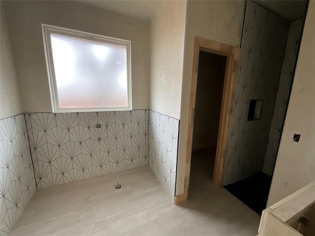 bathroom with tile walls and wainscoting