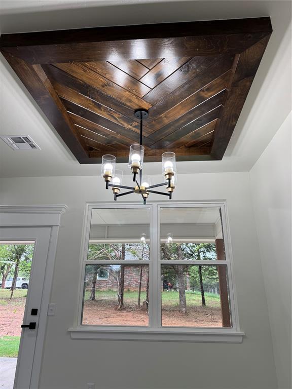 2402 Black Jack Way, Blanchard, OK 73010 - details with a chandelier and visible vents