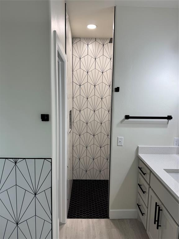 2402 Black Jack Way, Blanchard, OK 73010 - bathroom featuring vanity, recessed lighting, baseboards, and a stall shower