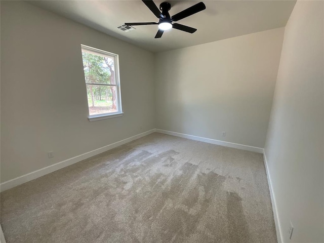 2402 Black Jack Way, Blanchard, OK 73010 - unfurnished room with baseboards, light carpet, a ceiling fan, and visible vents