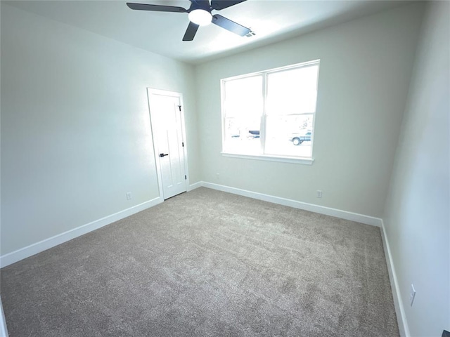 2402 Black Jack Way, Blanchard, OK 73010 - unfurnished room with baseboards, ceiling fan, and carpet