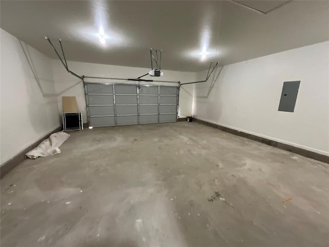 2402 Black Jack Way, Blanchard, OK 73010 - garage with baseboards, a garage door opener, and electric panel