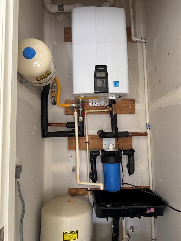 2402 Black Jack Way, Blanchard, OK 73010 - utilities with tankless water heater