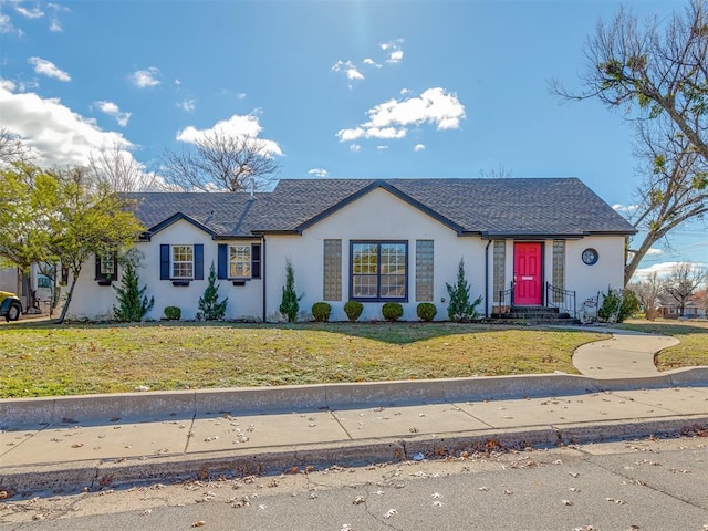 ranch-style house featuring a front yard