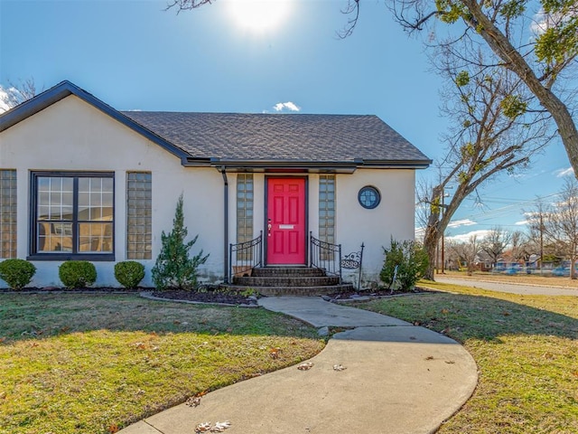 2832 NW 45th St, Oklahoma City, OK 73112 - view of front of property featuring stucco siding, a front yard, and a shingled roof