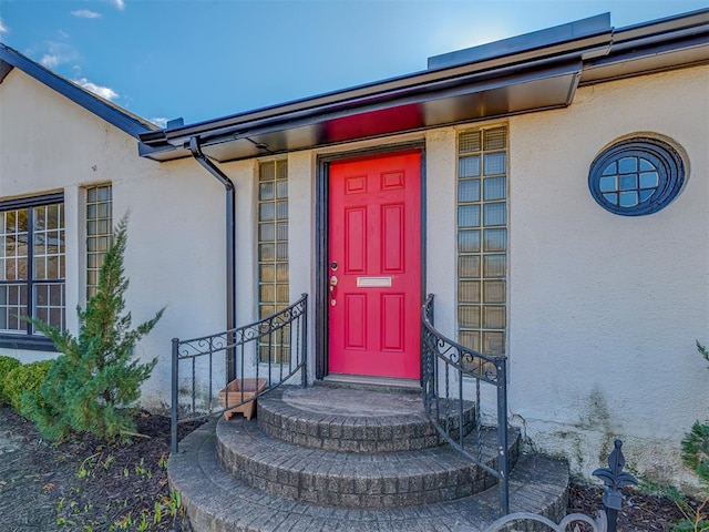 2832 NW 45th St, Oklahoma City, OK 73112 - doorway to property featuring stucco siding