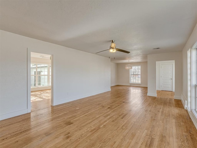 unfurnished room featuring ceiling fan and light wood-type flooring