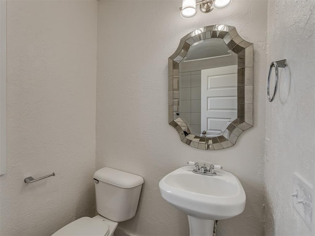 bathroom with sink and toilet