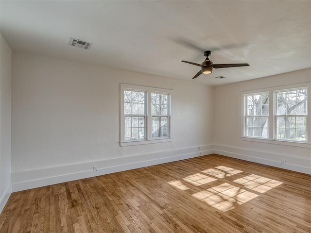 unfurnished room with ceiling fan and light hardwood / wood-style flooring