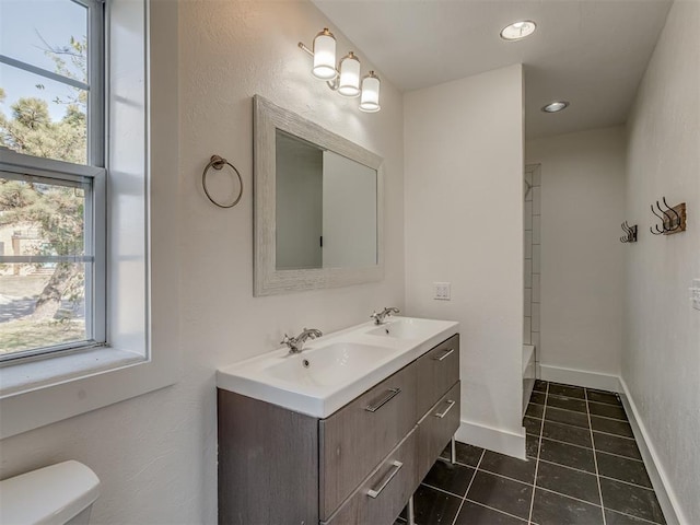 bathroom with tile patterned floors, vanity, and toilet