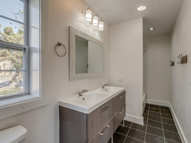 2832 NW 45th St, Oklahoma City, OK 73112 - full bath featuring double vanity, healthy amount of natural light, tile patterned floors, a shower, and recessed lighting