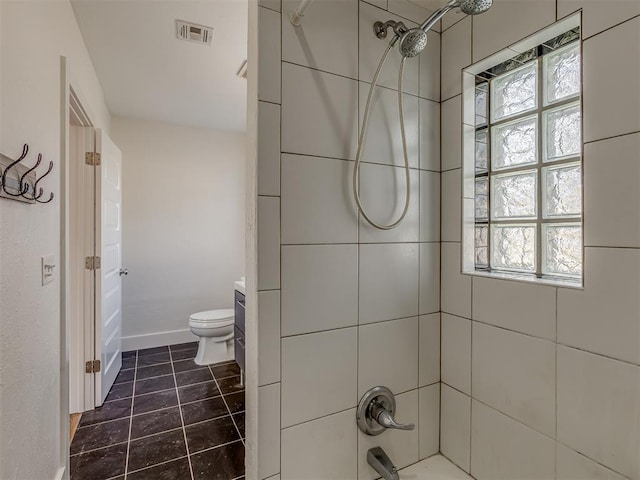 full bathroom with vanity, tiled shower / bath combo, toilet, and plenty of natural light