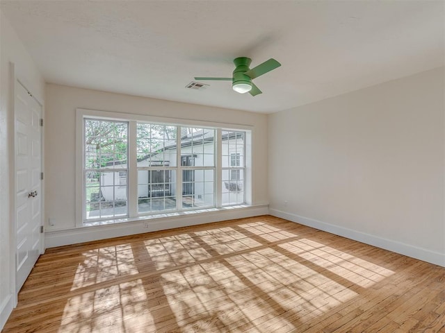 unfurnished room with ceiling fan and light hardwood / wood-style floors