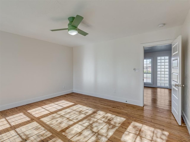 2832 NW 45th St, Oklahoma City, OK 73112 - spare room featuring wood finished floors, a ceiling fan, and a smoke detector
