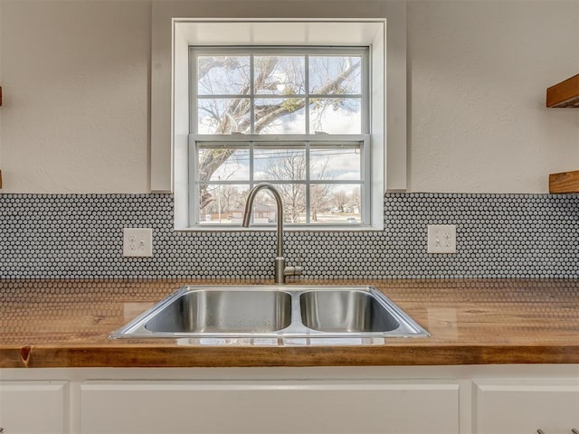 2832 NW 45th St, Oklahoma City, OK 73112 - kitchen view of decorative backsplash and white cabinetry