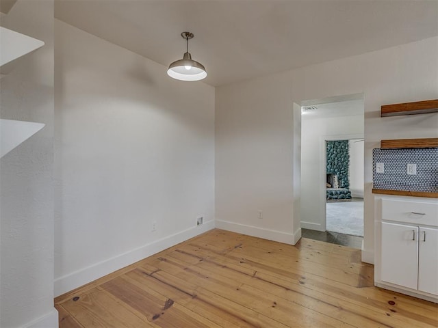 unfurnished dining area with light hardwood / wood-style flooring