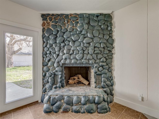 2832 NW 45th St, Oklahoma City, OK 73112 - detailed view of baseboards and a stone fireplace