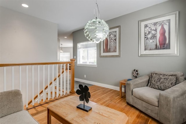 sitting room with hardwood / wood-style flooring