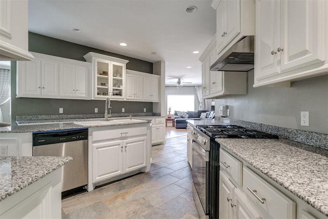 kitchen with white cabinetry, sink, ceiling fan, extractor fan, and appliances with stainless steel finishes