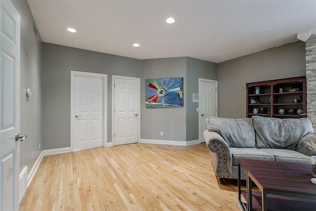 living room with light hardwood / wood-style flooring