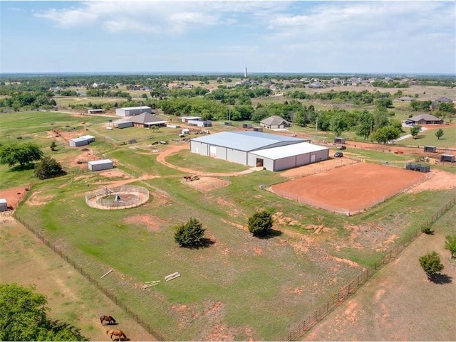 birds eye view of property featuring a rural view