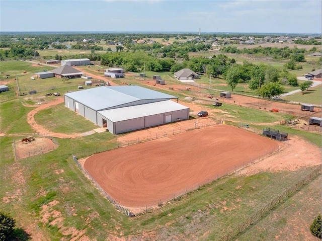 birds eye view of property with a rural view