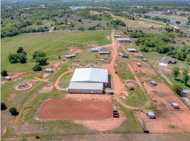 birds eye view of property featuring a rural view and a water view