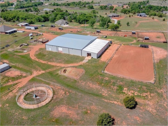 birds eye view of property with a rural view