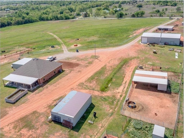 birds eye view of property with a rural view