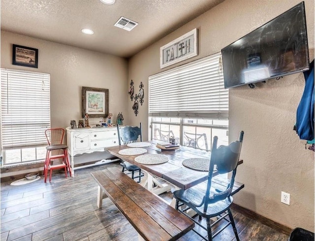 dining area featuring a textured ceiling