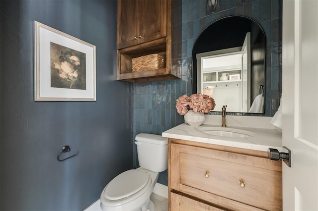 bathroom with vanity and toilet