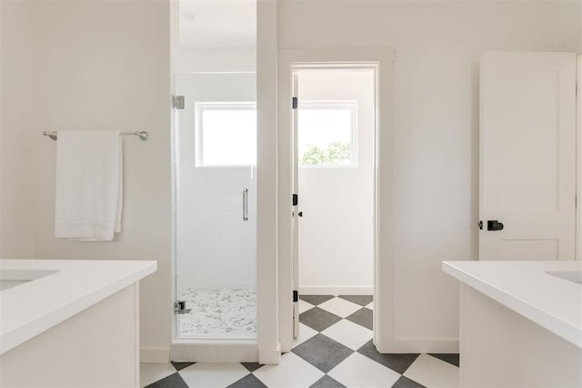 bathroom featuring vanity and an enclosed shower