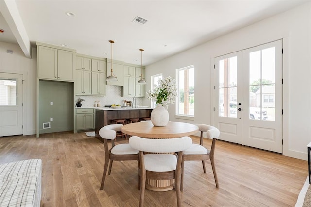 dining area featuring visible vents, recessed lighting, french doors, light wood-style floors, and baseboards