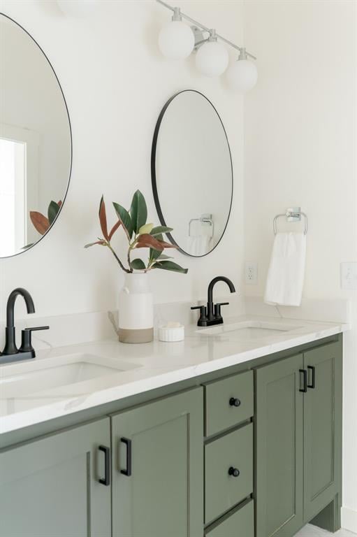 full bath with a sink and double vanity