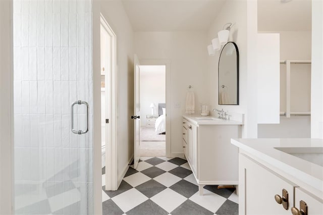 full bath with two vanities, a stall shower, tile patterned floors, ensuite bath, and a sink