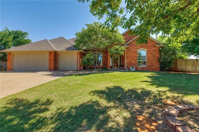 ranch-style home featuring a front yard and a garage