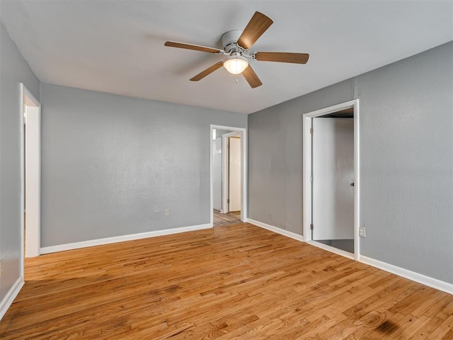 unfurnished bedroom with ceiling fan and light hardwood / wood-style floors