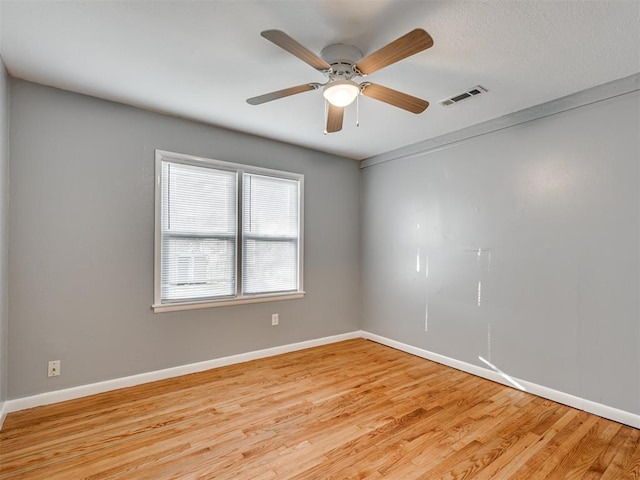 unfurnished room with ceiling fan and light hardwood / wood-style floors