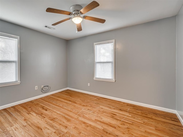 spare room with ceiling fan and light hardwood / wood-style flooring