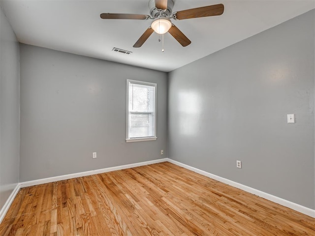 empty room with wood-type flooring and ceiling fan