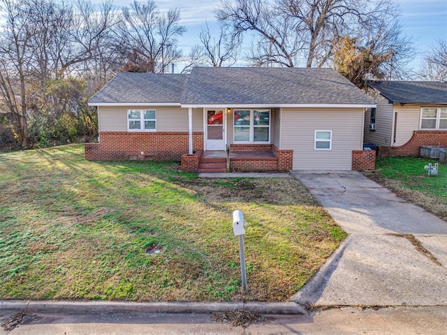 ranch-style house with a front lawn