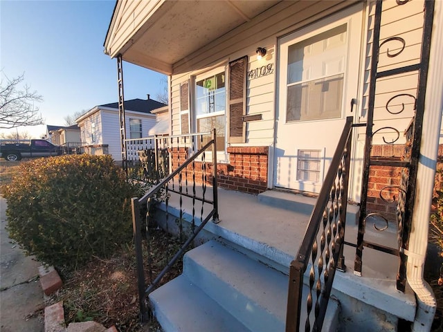 doorway to property featuring a porch